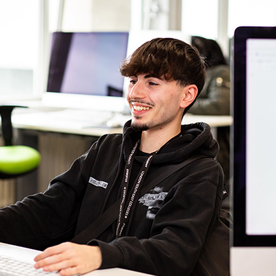 Learner smiling at work